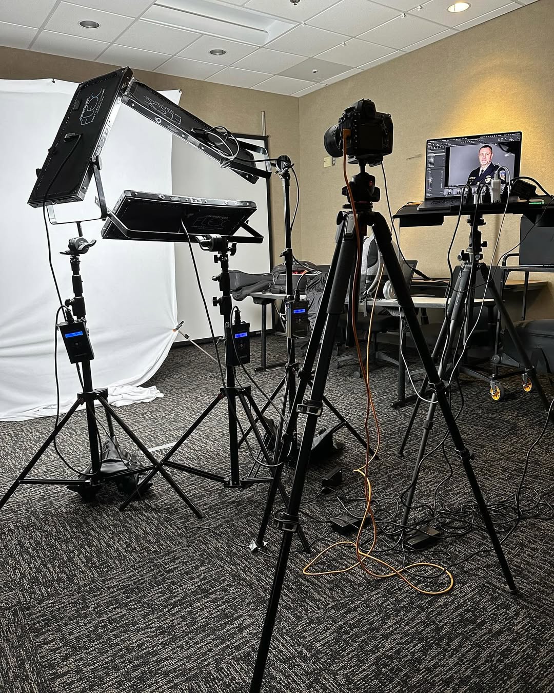 Photographer working with a client during a headshot session