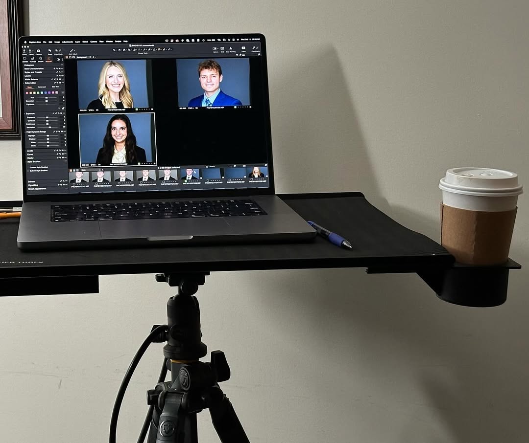Mark editing headshots on a computer.